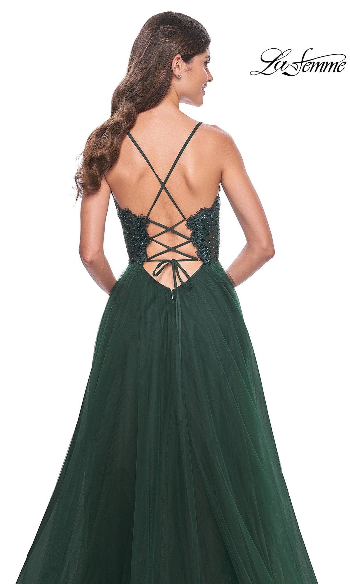 Woman wearing the La Femme Lace-Bodice Long A-Line Prom Dress 32306 in dark green, featuring spaghetti straps and a lace-up open back, shown from behind against a white background.